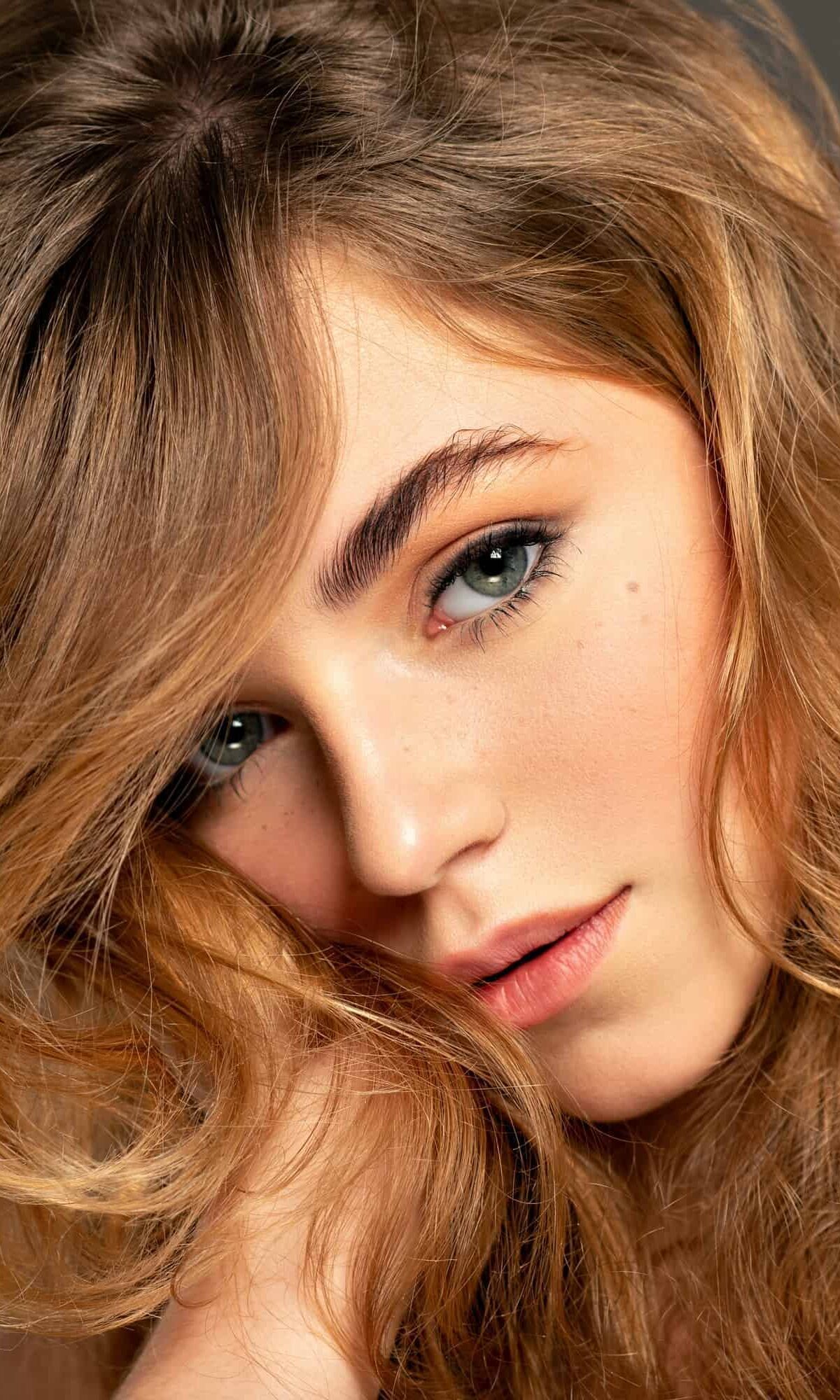 closeup-portrait-of-an-young-adult-girl-with-long-curly-hair-fashion-model.jpg